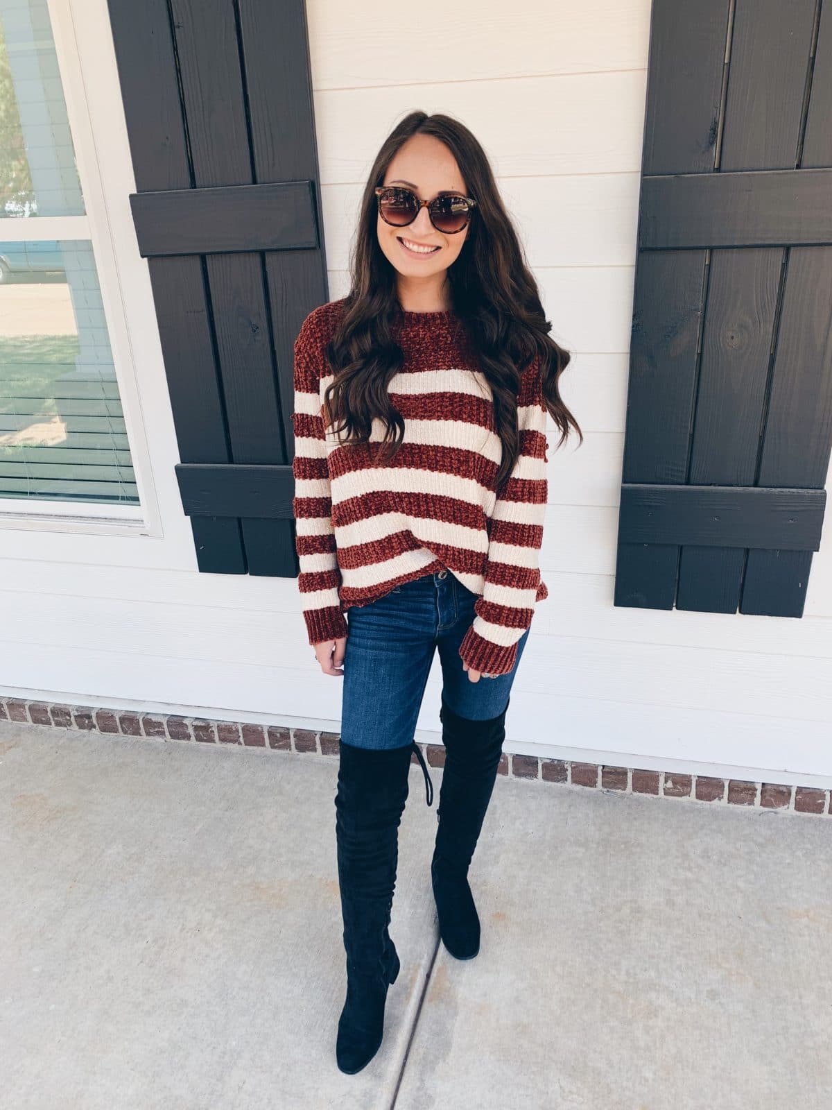 Striped Chenille sweater paired with jeans and over the knee boots for fall